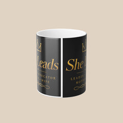 Color Morphing Mug — "She Leads" Gold Script Leadership Coffee Mug, 11oz